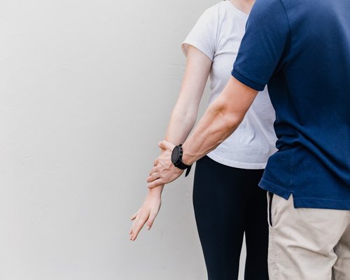 Person making slight postural adjustments while standing
